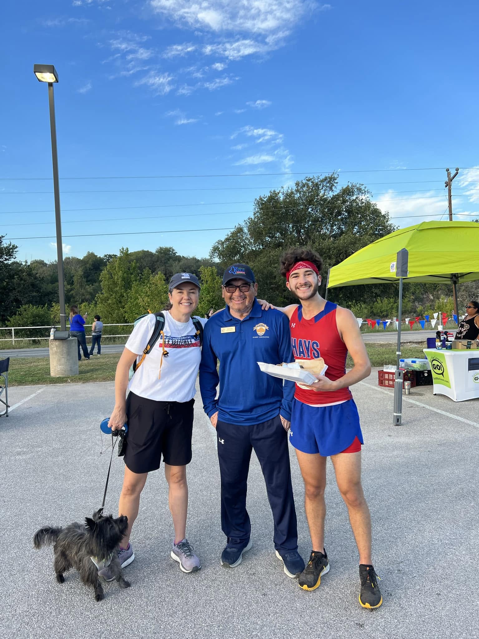 Robert Rizo with participants at a community running event