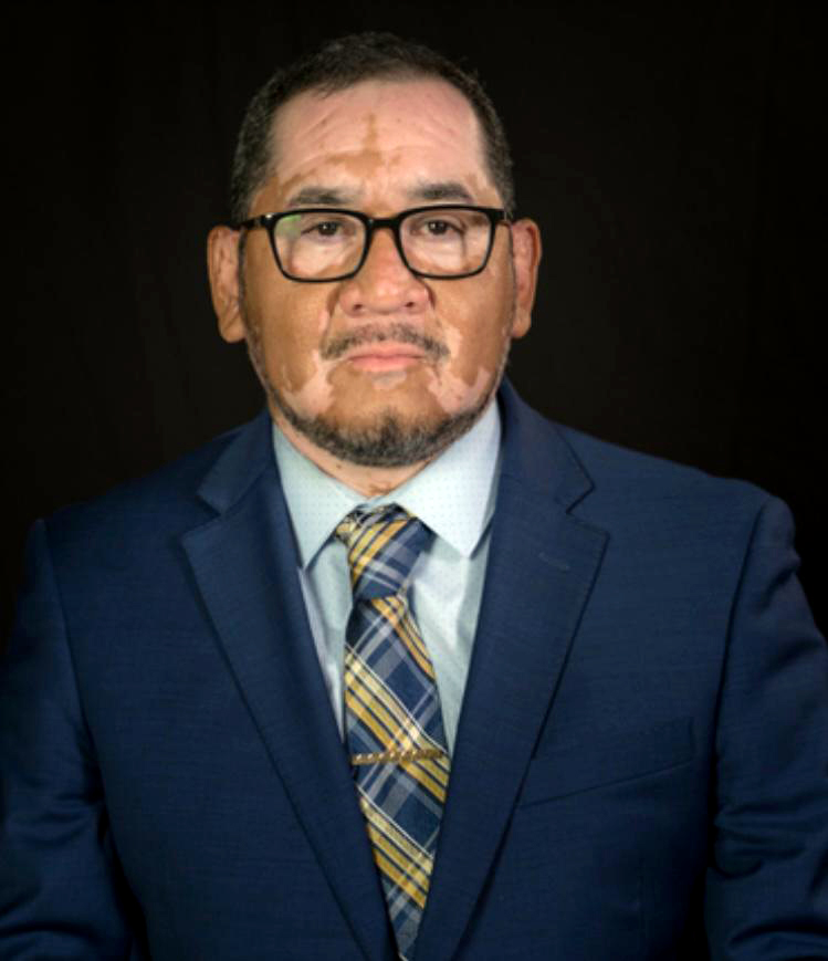 Robert Rizo speaking at a community event